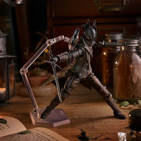 "Premium articulated Bloodborne Hunter figma, Old Hunter Ver. Gallery views show its dark gothic aesthetic, intricate attire, and weaponry."