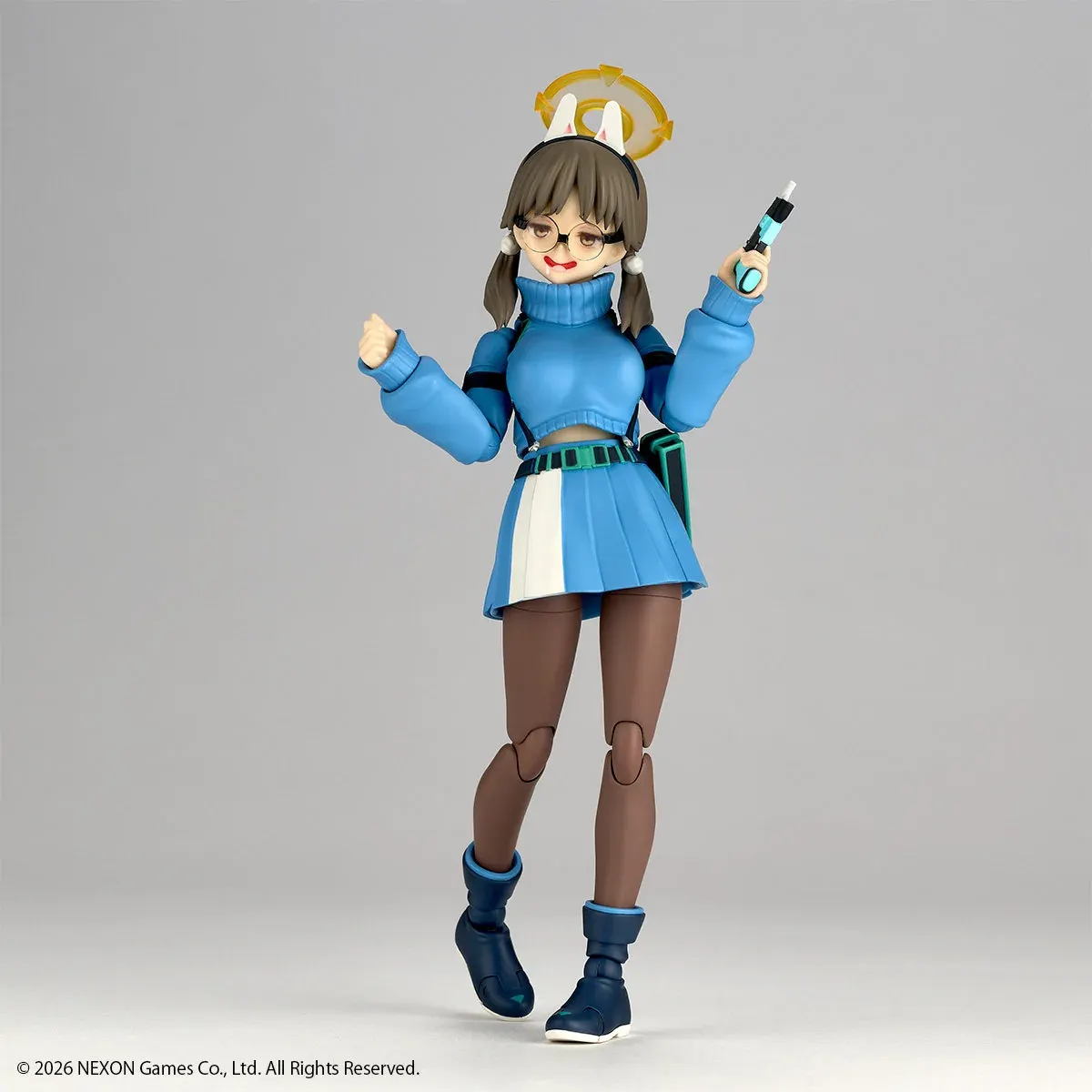 "Kaiyodo Revoltech Blue Archive Moe figure displays dynamic posing, interchangeable parts, and anime-accurate sculpting details from playful angles."