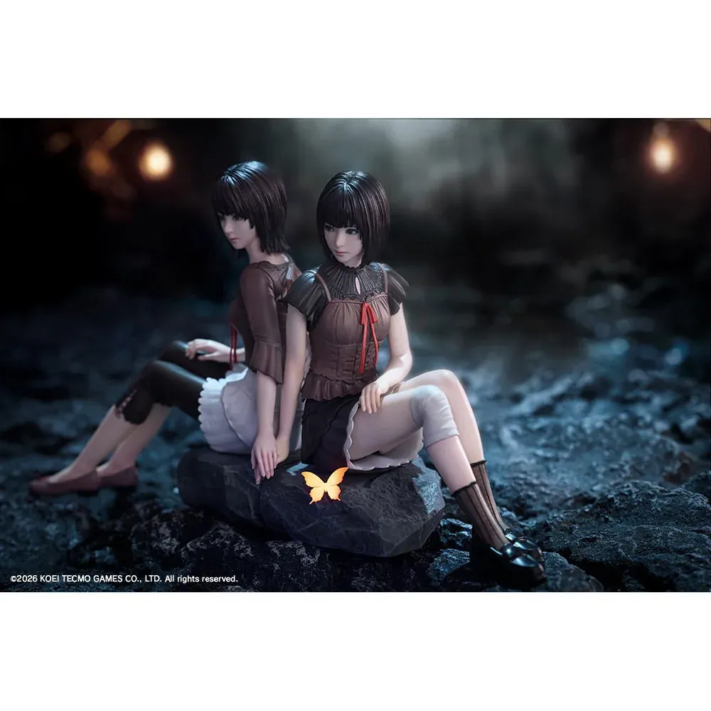 Mio and Mayu Amakura sit back-to-back on dark rock in this Kotobukiya Zero Crimson Butterfly figure diorama, with a glowing butterfly.