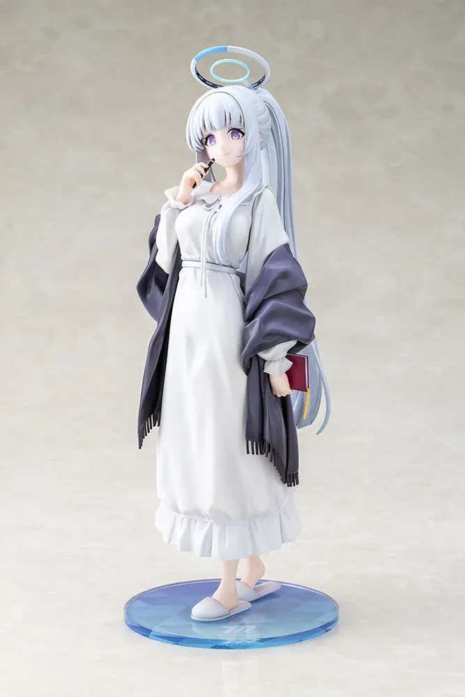 Blue Archive Noa figure by Kotobukiya in a soft white nightgown and indigo shawl, glowing blue halo above her silver hair.